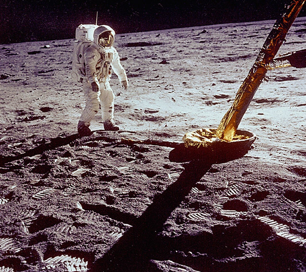 Astronaut Stands Near Lunar Module Leg