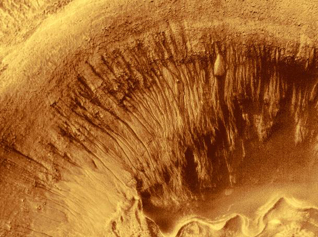 Evidence for Recent Liquid Water on
Mars: Channeled Aprons in a Small Crater
within Newton Crater